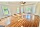 Spacious main bedroom features hardwood floors, tray ceiling, and lots of windows at 1040 Rock Creek Rd, Social Circle, GA 30025