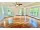 Spacious main bedroom features hardwood floors, tray ceiling, and multiple windows at 1040 Rock Creek Rd, Social Circle, GA 30025