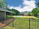 Fenced pool area highlighting an in-ground pool and outdoor living space, perfect for entertaining at 1040 Rock Creek Rd, Social Circle, GA 30025