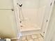 The bathroom features a functional shower with a convenient handheld shower head for easy use at 1040 Rock Creek Rd, Social Circle, GA 30025
