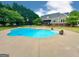 A clear, inviting in-ground pool is the focal point of this spacious yard and beautiful home at 1040 Rock Creek Rd, Social Circle, GA 30025