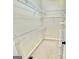 Walk-in closet offers carpet floor and white wire shelving for optimal storage at 1040 Rock Creek Rd, Social Circle, GA 30025