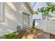 Back patio with small porch, chair, and sliding glass doors at 402 Sherrels Frd, Peachtree City, GA 30269