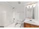 Clean bathroom with tub, toilet, vanity, and mirror, providing a functional space at 402 Sherrels Frd, Peachtree City, GA 30269