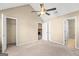 Bedroom featuring vaulted ceilings, carpet, fan, and access to a fireplace at 402 Sherrels Frd, Peachtree City, GA 30269