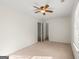 Bedroom featuring neutral walls, carpet, ceiling fan, and closet at 402 Sherrels Frd, Peachtree City, GA 30269