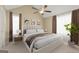 Comfortable bedroom features neutral tones, a large bed, and soft, natural lighting at 402 Sherrels Frd, Peachtree City, GA 30269