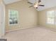 Bedroom featuring vaulted ceilings, carpet, fan, and a window with blinds at 402 Sherrels Frd, Peachtree City, GA 30269