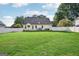 Well-maintained backyard with lush lawn and white fence at 612 Longer Dr, Peachtree City, GA 30269