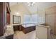 Luxurious bathroom with a soaking tub, glass-enclosed shower, and custom vanity for a spa-like experience at 612 Longer Dr, Peachtree City, GA 30269