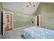 Spacious bedroom featuring vaulted ceilings and a walk in closet, offering plenty of storage at 612 Longer Dr, Peachtree City, GA 30269
