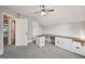 Angled room with custom built-in desk and cabinets near an open door at 612 Longer Dr, Peachtree City, GA 30269
