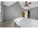 Spacious bedroom with grey walls features a ceiling fan, closet and ensuite access at 612 Longer Dr, Peachtree City, GA 30269