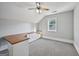 Angled room with custom built-in desk, cabinets, and window at 612 Longer Dr, Peachtree City, GA 30269