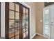 Elegant office with French doors, hardwood floors, and a view to the outside, perfect for remote work at 612 Longer Dr, Peachtree City, GA 30269
