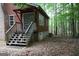 Exterior view of porch steps leading to the back of the house at 695 Frog Rd, Locust Grove, GA 30248