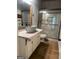 Bathroom featuring a sink with industrial faucet, quartz countertop, and walk-in shower at 695 Frog Rd, Locust Grove, GA 30248