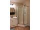 Bathroom featuring a stand-up shower, modern fixtures, vanity, and neutral wall tones at 695 Frog Rd, Locust Grove, GA 30248