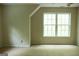 Spacious bedroom with carpeted floors, large windows and neutral walls for a soothing retreat at 695 Frog Rd, Locust Grove, GA 30248