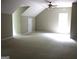 Large bonus room with high ceilings, natural light, and a neutral color palette at 695 Frog Rd, Locust Grove, GA 30248