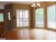 Open dining area with hardwood floors and an abundance of natural light through large windows at 695 Frog Rd, Locust Grove, GA 30248