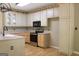Functional kitchen with stainless appliances, wood cabinets, and ample counter space at 695 Frog Rd, Locust Grove, GA 30248