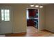 Open dining area with hardwood floors showcasing view into kitchen, blending living and cooking spaces at 695 Frog Rd, Locust Grove, GA 30248