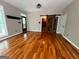 Living room with hardwood floors, rustic barn door, and ample natural light at 695 Frog Rd, Locust Grove, GA 30248