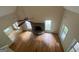 Open living room with vaulted ceiling, hardwood floors, stone fireplace, and ample natural light at 695 Frog Rd, Locust Grove, GA 30248