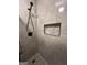 Stylish shower featuring gray tiling, sleek fixtures, and a convenient built-in niche at 695 Frog Rd, Locust Grove, GA 30248