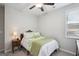 Cozy bedroom features a comfortable bed, side table, and a bright window at 120 Westover Commons, Fayetteville, GA 30214