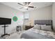 Comfortable bedroom featuring ceiling fan, neutral colors, and bright window at 120 Westover Commons, Fayetteville, GA 30214