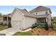 Charming home featuring a well-kept lawn, two-car garage, and inviting front porch at 120 Westover Commons, Fayetteville, GA 30214