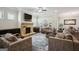 Elegant living room with a stone fireplace, neutral decor, and a cozy seating arrangement, perfect for relaxation at 120 Westover Commons, Fayetteville, GA 30214