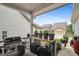 Cozy covered porch with grill, gardening station, and neighborhood views at 120 Westover Commons, Fayetteville, GA 30214
