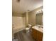 Bathroom featuring shower-tub combo, toilet, single sink vanity, and neutral paint at 253 Whistle Way, Locust Grove, GA 30248