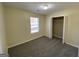 Bedroom with neutral walls, carpet, a window, and a closet at 253 Whistle Way, Locust Grove, GA 30248