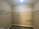 Walk-in closet features neutral walls, carpet, and a metal rack at 253 Whistle Way, Locust Grove, GA 30248