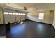 Spacious garage featuring black epoxy floors, a garage door, and a window at 253 Whistle Way, Locust Grove, GA 30248