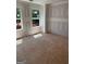 Bright and airy bedroom features two large windows and ample natural light at 107 Oak Rd, Locust Grove, GA 30248