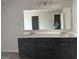 This bathroom features a dual vanity at 1124 Pebble Creek Ln, Locust Grove, GA 30248