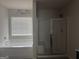This bathroom features a bathtub, shower, and 'Relax, Renew, Refresh' wall art at 1124 Pebble Creek Ln, Locust Grove, GA 30248