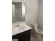 This bathroom features a vanity sink and commode at 1124 Pebble Creek Ln, Locust Grove, GA 30248