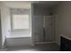 A spacious Primary bathroom features a dual vanity at 1124 Pebble Creek Ln, Locust Grove, GA 30248