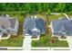 Aerial shot of a home nestled in a neighborhood with manicured lawns and lush, green trees at 19 Mediterranean Ave # 506, Sharpsburg, GA 30277