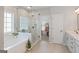 Luxurious bathroom featuring a modern soaking tub, glass-enclosed shower, and elegant marble accents at 19 Mediterranean Ave # 506, Sharpsburg, GA 30277