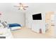Large bedroom includes TV, dresser, and doorway to bathroom with double vanity at 19 Mediterranean Ave # 506, Sharpsburg, GA 30277