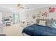 Spacious bedroom with seating area, large window, and light colored walls at 19 Mediterranean Ave # 506, Sharpsburg, GA 30277