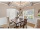 Open dining room area with natural light, wood floors, and a decorative ceiling fixture at 19 Mediterranean Ave # 506, Sharpsburg, GA 30277
