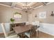 Elegant dining room featuring a coffered ceiling, chandelier, hardwood floors, and stylish decor at 19 Mediterranean Ave # 506, Sharpsburg, GA 30277